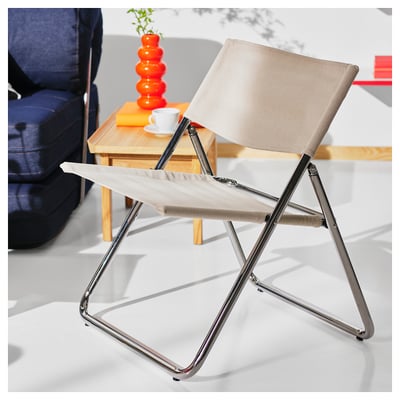 Ikea MOFALLA bílá skládací židle s chromovaným rámem.