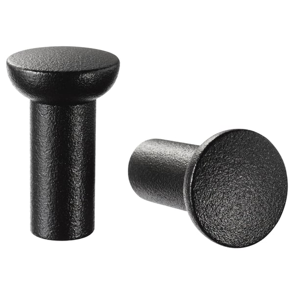 Dva černé válcové knoflíky se zaoblenými vrcholy, potažené epoxidem/polyesterem, zobrazené vedle sebe.