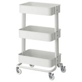 Ikea RÅSKOG: kompaktní, bílý, 3patrový úložný vozík na kolečkách pro malé prostory, robustní design.