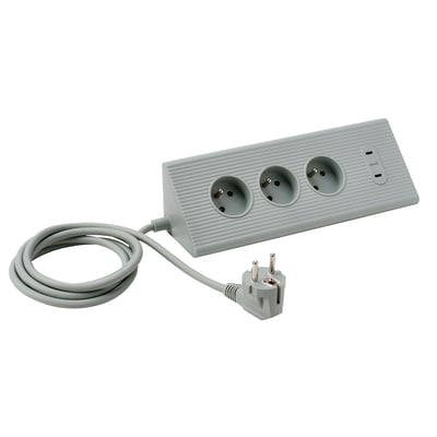 SKOTAT šedý prodlužovací kabel, minimalistický design, tři vývody, zaoblený tvar.