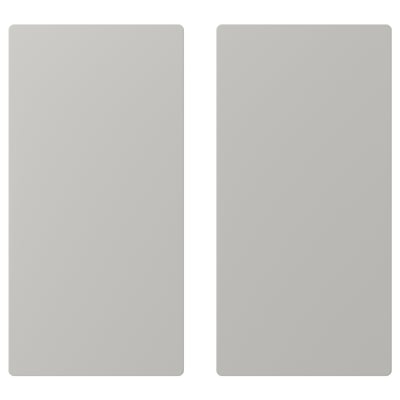 Dva šedé obdélníkové panely, pravděpodobně dvířka pro skladování SMÅSTAD, s měkkými zaoblenými hranami a jednoduchým, moderním designem.