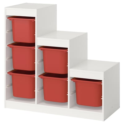 Úložný díl Ikea TROFAST s červenými přihrádkami, bílý rám, kostkový design pro dětské pokoje.