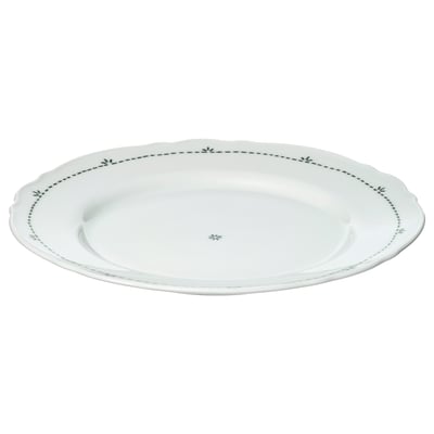Bílý talíř UPPLAGA s měkkým volánkovým okrajem a černým květinovým okrajem. Vyrobeno z porcelánu, má venkovský design.