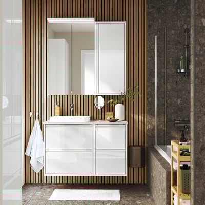 Modern white vanity with 4 shelves, sink, mirror, & wood accents. Wall-mounted, ample storage, open feel. Wood slats & marble walls, small rug.