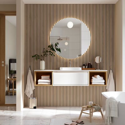 Modern bathroom with ÄNGSJÖN washstand, open shelves, basin, bathtub, stool, and minimalist mirror.