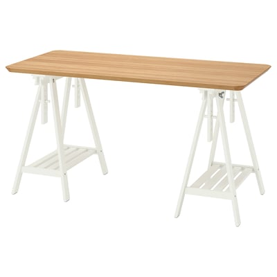 A white ANFALLARE desk with a wooden top, featuring trestle legs and a shelf underneath.