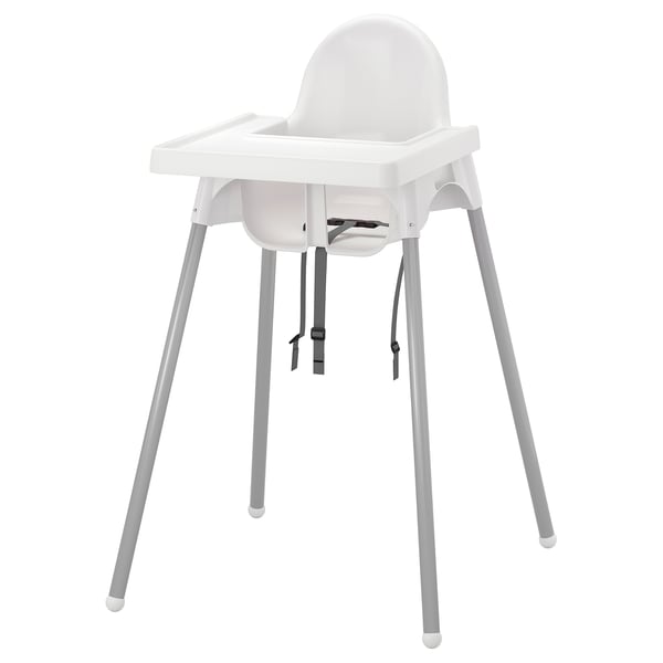 White ANTILOP highchair, made of plastic and steel, with grey legs, for childrens safety.