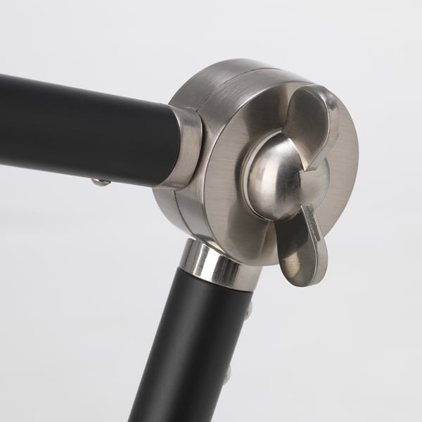 Image shows a modern floor lamps metallic joint, featuring brushed nickel-plated finish and adjustable design.