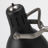 Adjustable modern floor lamp with metallic finish, seen from top.