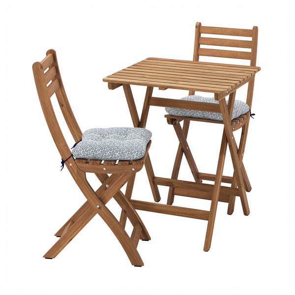 Wooden outdoor table and two chairs with gray cushions.
