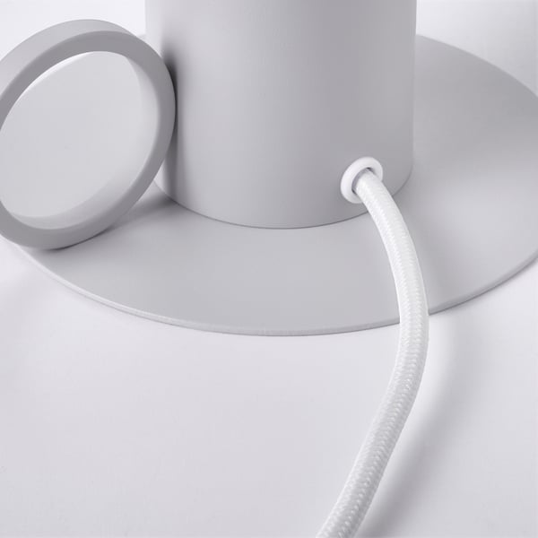 Modern lamp with sleek design: grey base, white cord, and glass shade. Elegant and minimalist.