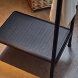 Black step stool with side rail in dark grey for bathroom or home use, non-slip, easy-grip for support.