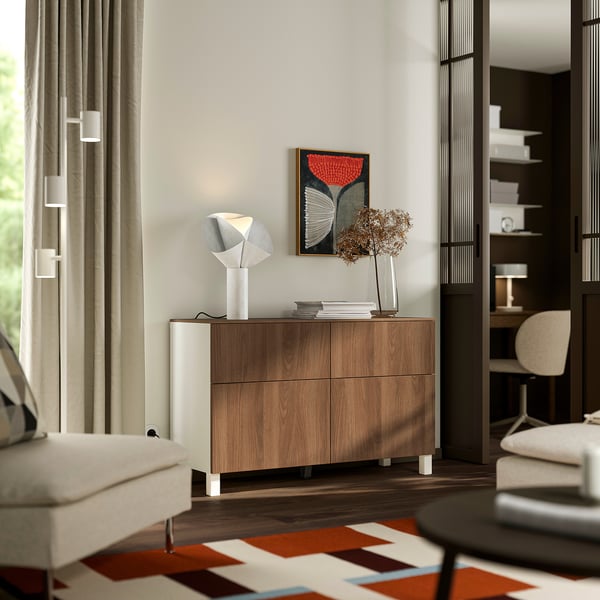 Modern living room with BESTÅ sideboard. Wooden, four drawers, lamp, vase, window, curtains.