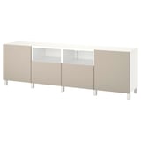 An ikea BESTÅ tv bench in white and beige. It drawers and shelves for storage, with a modern and minimalist design.
