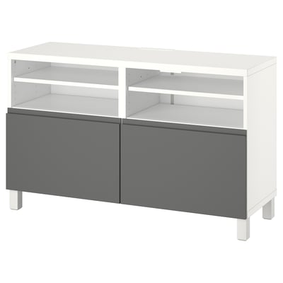 White and gray BESTÅ tv bench with open shelves and cabinets.