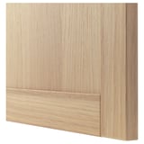Image shows a light-colored wooden panel, part of ikeas BESTÅ tv unit, with visible grain texture and smooth finish.