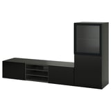 A modern black BESTÅ tv bench with shelves and drawers, combining storage and cable management.