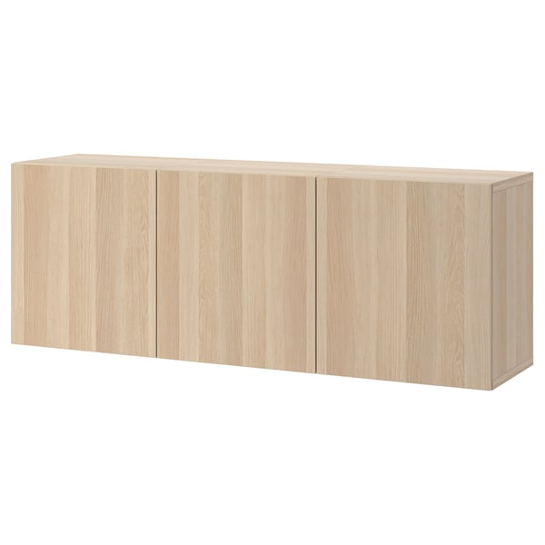 A light wood-colored BESTÅ wall-mounted cabinet, featuring a sleek rectangular design and adjustable shelves, providing airy and functional storage.