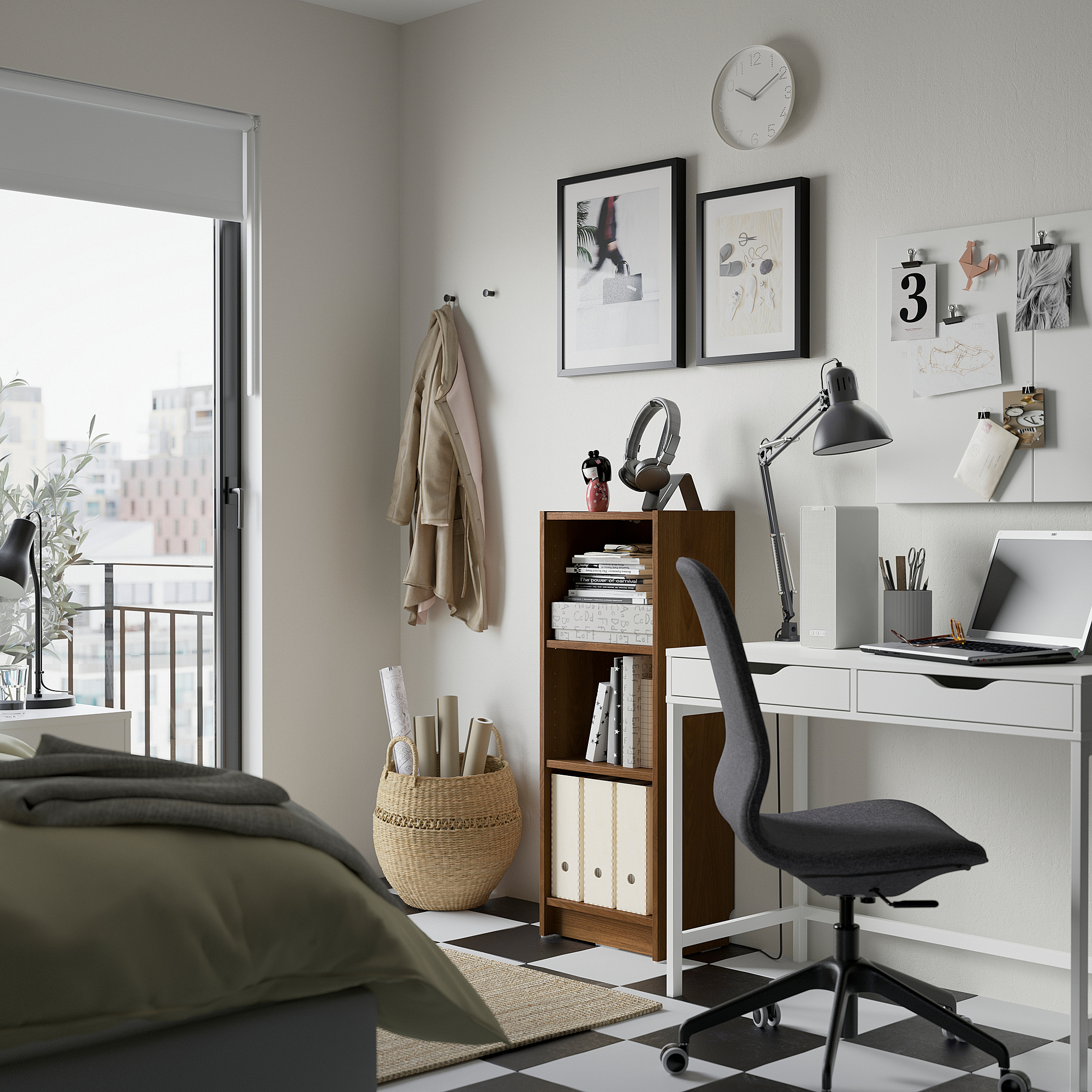 Modern home office with BILLY bookcase, desk, art, and bed.