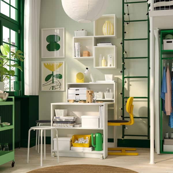 Bright office with BILLY bookcase, white & yellow. Includes shelves, boxes, yellow chair, under counter.
