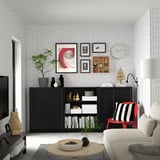 Modern living room with BILLY bookcase, sofa, red chair, tv, decor.
