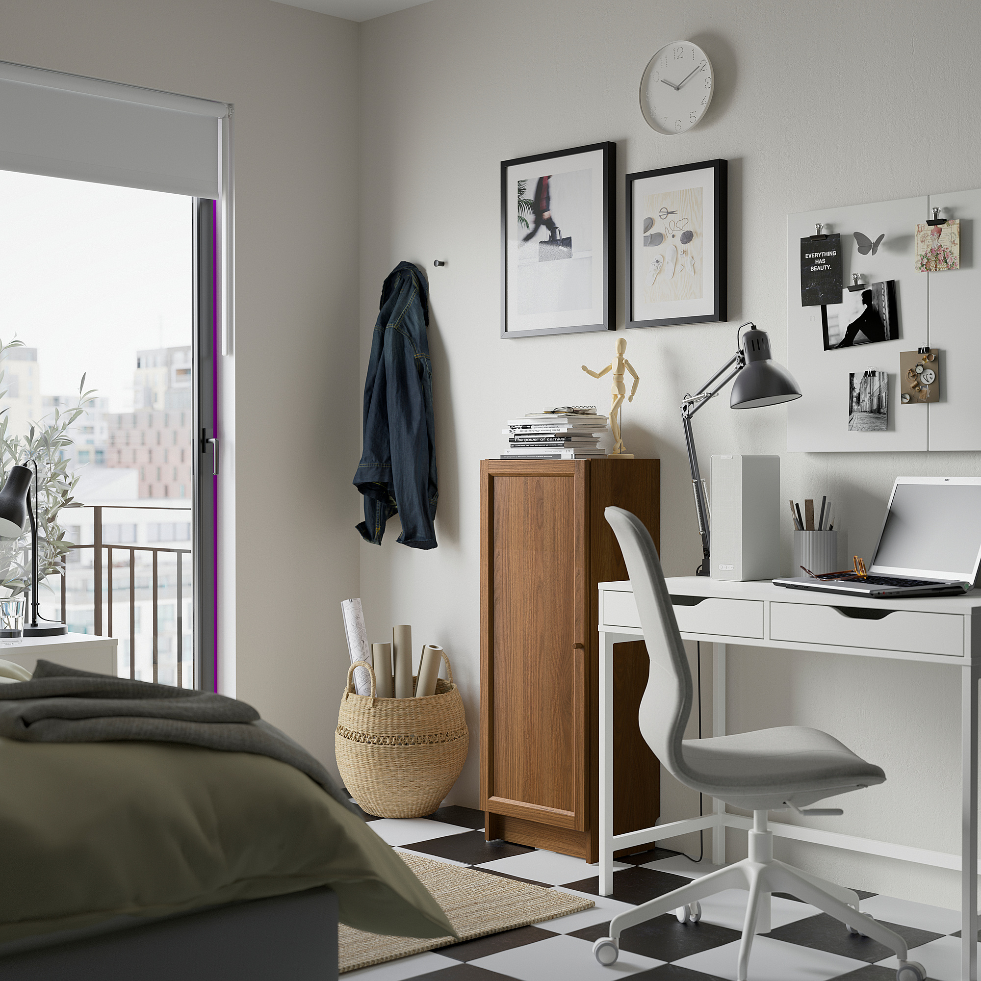 Modern bedroom with BILLY bookcase, laptop, round clock, white chair, green bed blanket, and artworks.
