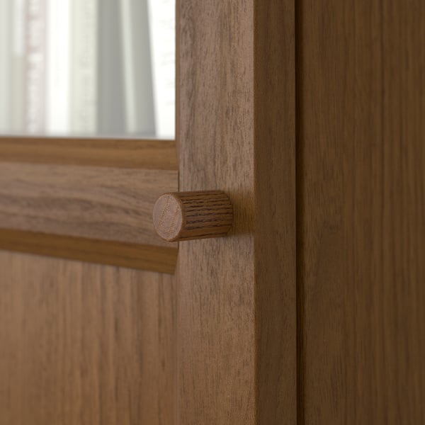 Close-up of wooden door hinge; shows high-quality craftsmanship, smooth finish, and sturdy construction.