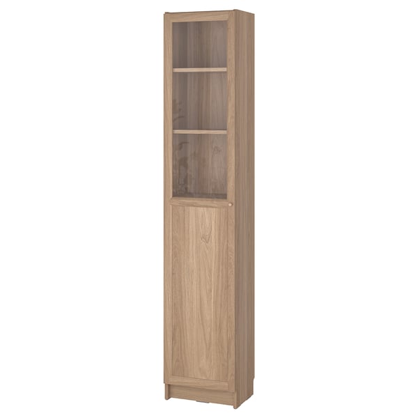 A BILLY bookcase in oak finish, featuring a wooden frame and glass door.