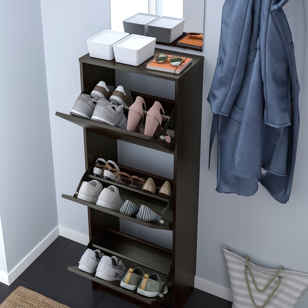 Shoe cabinet with adjustable shelves and open compartments.