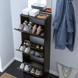 Shoe cabinet with adjustable shelves and open compartments.