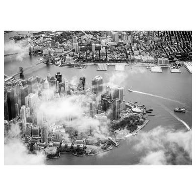 Black and white aerial cityscape photo featuring waterfront, skyscrapers, bridges, and urban sprawl.