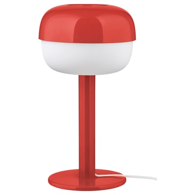 A red BLÅSVERK lamp with a white top, cylindrical base, and modern design.
