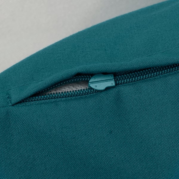 Teal cushion with zipper, made from recycled polyester.