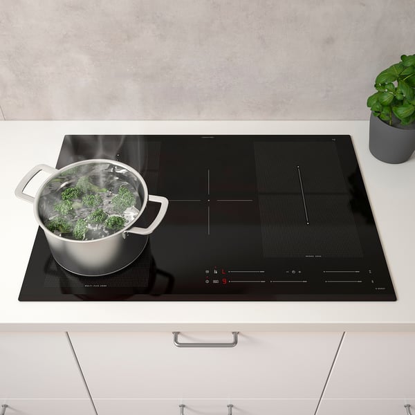 Broccoli boiling on BLIXTSNABB induction hob with touch controls.