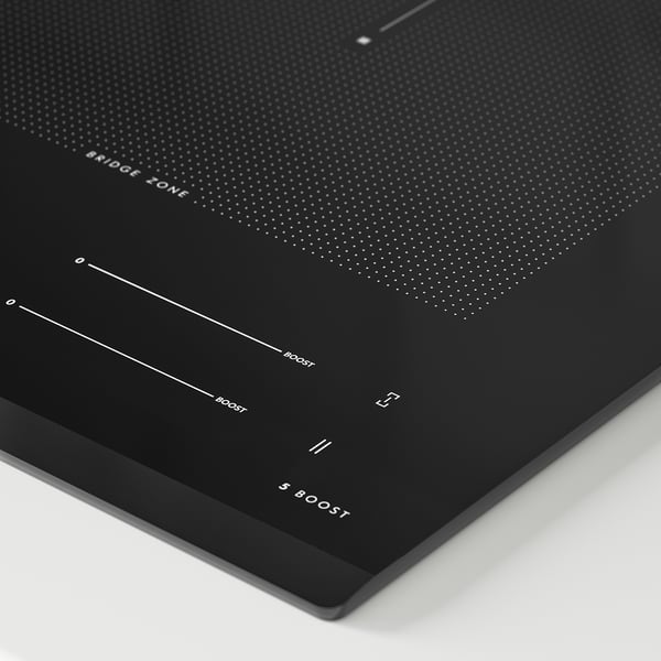Black induction hob with beveled edge, five cooking zones, touch controls, and boost functions.