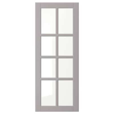 Soft grey BODBYN kitchen door with framed design and beveled glass.