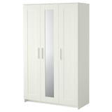 White BRIMNES wardrobe with mirrored door, panel design, adjustable shelves for space-saving storage.
