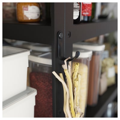 Black BROR storage hooks hold white onions in a kitchen, showcasing organizers sleek design.