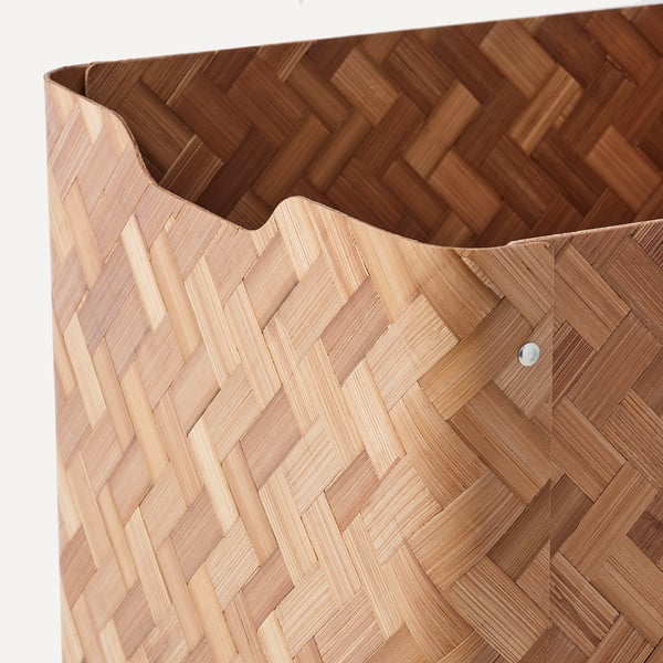 Woven bamboo storage basket with intricate pattern, featuring sturdy construction and natural brown color.