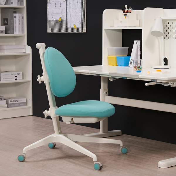 Blue DAGNAR chair with height adjustment, white desk, lamp, storage, padded for long hours.