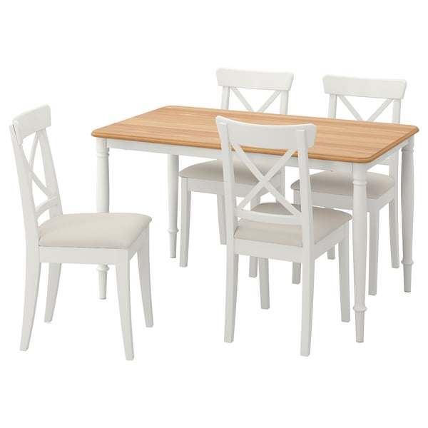 A white DANDERYD dining set with a wooden top rectangular table and four cushioned chairs.