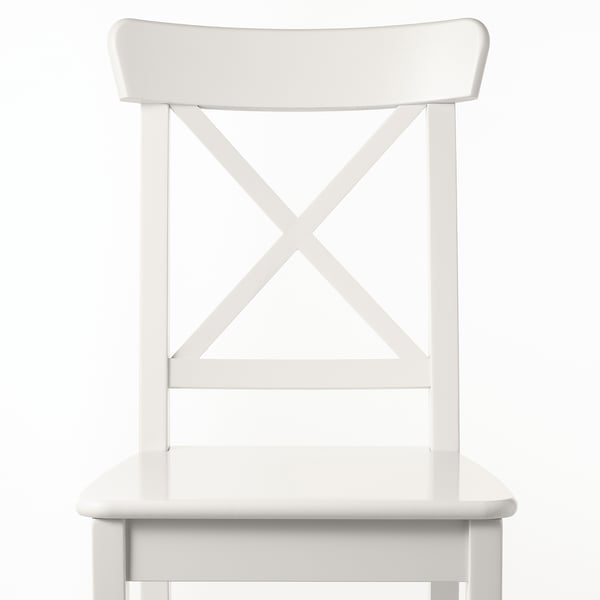 White chair with sleek design, featuring sturdy wooden seat and back, supported by stylish x-shaped metal legs.
