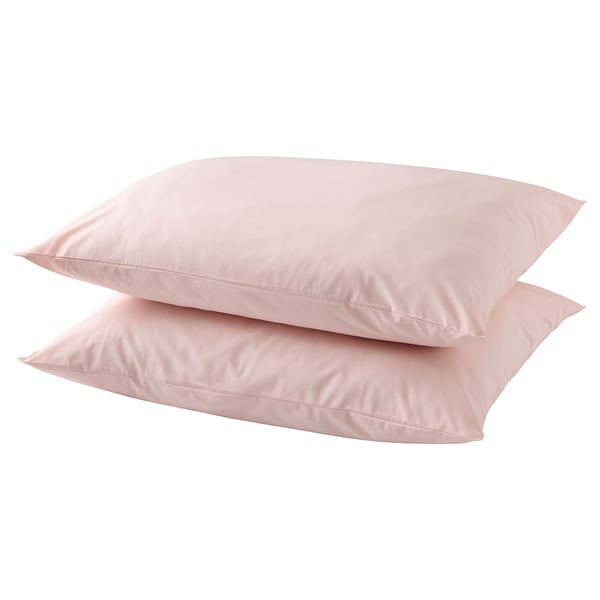 Two light pink cotton pillows stacked neatly.