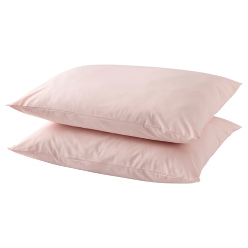 Two light pink cotton pillows stacked neatly.