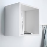 A wall-mounted cube shelf, part of the EKET system, stores books and holds items on its shelf.
