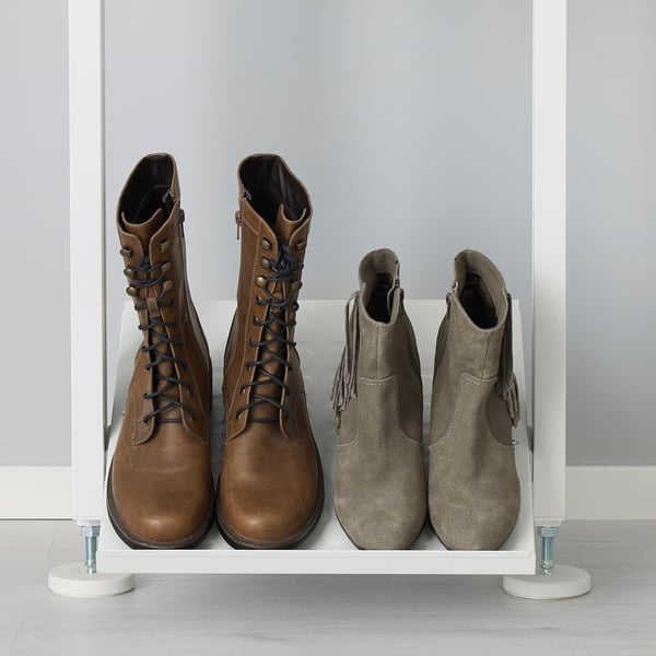 Shoe rack with adjustable shelves. Holds 4 pairs of boots. White frame, grey wall background.