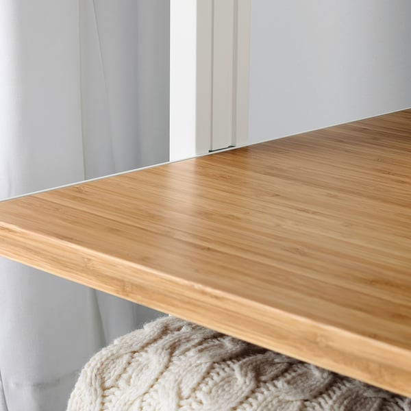 Close-up of wooden shelf showing slow-closing mechanism.