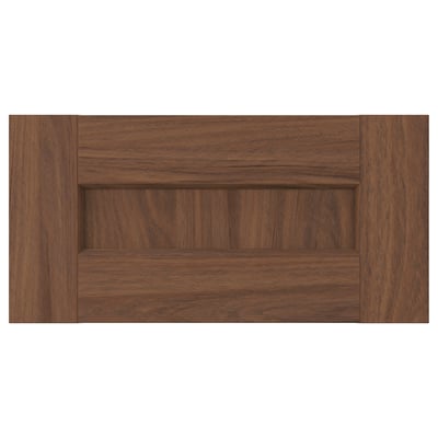 A brown wooden drawer front, square-shaped, with a subtle grain design.