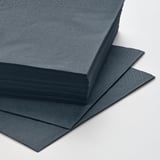 Stacked dark blue FANTASTISK napkins, neatly arranged in a pile, showcasing their soft texture and smooth edges.