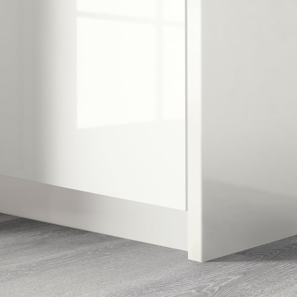Modern wardrobe with high-gloss, seamless white cover panel. Finished with smooth edges.
